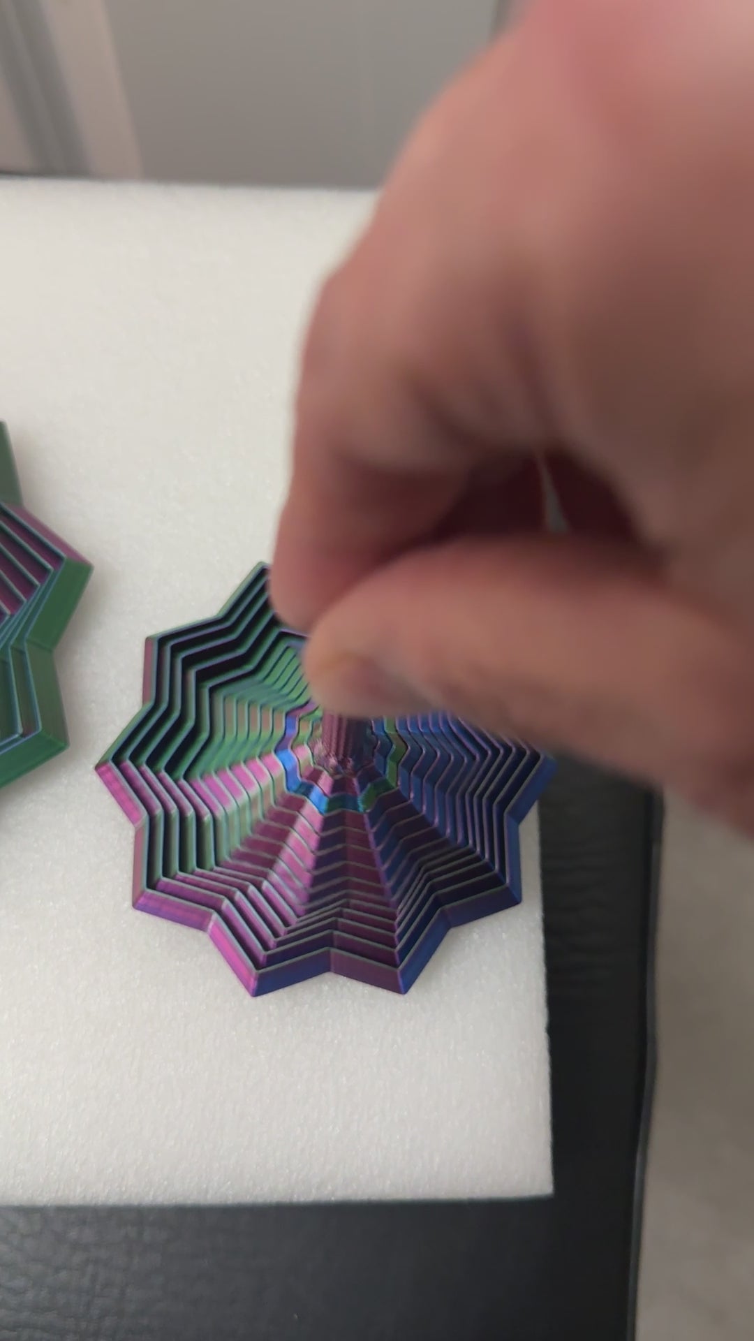 Video of playing with the 3D printed star fidget toy with a handle